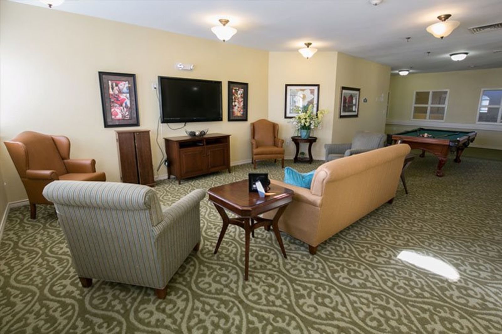 Lounge area with seating and fireplace